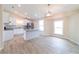 Open floor plan featuring a kitchen island overlooking a bright living space at 2486 Ainsworth Ave, Deltona, FL 32738