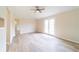 Bright living room featuring French doors, neutral walls, and light wood-look tile flooring at 2486 Ainsworth Ave, Deltona, FL 32738