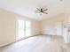 This room provides French doors, ceiling fan, neutral paint and wood-look flooring at 2486 Ainsworth Ave, Deltona, FL 32738