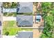 An aerial view of the home's roof and surrounding greenery showcases its serene setting at 25106 Quaker Ridge Ave, Sorrento, FL 32776
