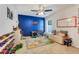 Bright bedroom featuring playful decor, a colorful rug, and ample space for a activities at 25106 Quaker Ridge Ave, Sorrento, FL 32776