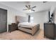 Bedroom featuring a comfy bed, ceiling fan, and neutral walls at 25106 Quaker Ridge Ave, Sorrento, FL 32776