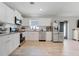 Beautiful kitchen with stainless appliances and white cabinetry at 25106 Quaker Ridge Ave, Sorrento, FL 32776