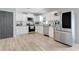 Bright kitchen features white cabinets and stainless steel appliances at 25106 Quaker Ridge Ave, Sorrento, FL 32776