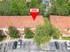 Aerial view of the property showcasing its tiled roof and nearby parking at 2662 Mayaguana St, Kissimmee, FL 34747