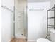 Bathroom with glass enclosed shower and linen closet at 2662 Mayaguana St, Kissimmee, FL 34747