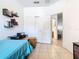 Bedroom with tiled floors, fan, closet and desk at 2662 Mayaguana St, Kissimmee, FL 34747