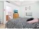 Comfortable bedroom with TV, vanity area, and view to the en-suite bathroom at 2662 Mayaguana St, Kissimmee, FL 34747