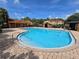 Community pool surrounded by lounging areas, offering a perfect spot for relaxation and socializing at 2662 Mayaguana St, Kissimmee, FL 34747