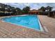 Expansive community pool with clearly marked lanes and lifeguard stand, offering a safe and enjoyable swim at 2662 Mayaguana St, Kissimmee, FL 34747