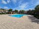 Well maintained community pool with pool furniture and covered gazebos, perfect for relaxing and entertaining at 2662 Mayaguana St, Kissimmee, FL 34747