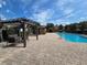 Resort-style pool with pergola and lounge chairs for residents' relaxation and enjoyment at 2662 Mayaguana St, Kissimmee, FL 34747