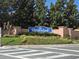 Welcoming Crestwynd community sign with mature landscaping and crosswalk for pedestrian safety at 2662 Mayaguana St, Kissimmee, FL 34747