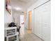 Hallway with tiled floors, white walls, and closet at 2662 Mayaguana St, Kissimmee, FL 34747