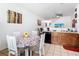 Open kitchen area with stainless steel appliances and a view into the dining and living spaces at 2662 Mayaguana St, Kissimmee, FL 34747