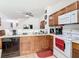 Well-equipped kitchen with essential appliances and tiled flooring at 2662 Mayaguana St, Kissimmee, FL 34747