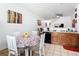 Eat-in kitchen features wood cabinets, tile floor, and a dining area at 2662 Mayaguana St, Kissimmee, FL 34747