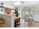Bright kitchen with wooden cabinets, stainless steel appliances, and a charming breakfast nook with natural light at 2662 Mayaguana St, Kissimmee, FL 34747