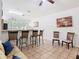 Open concept living room with bar seating and natural lighting at 2662 Mayaguana St, Kissimmee, FL 34747