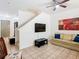 Comfortable living room featuring stairs and neutral decor at 2662 Mayaguana St, Kissimmee, FL 34747