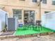 Cozy outdoor patio featuring a seating area and artificial grass, perfect for relaxing and enjoying the fresh air at 2662 Mayaguana St, Kissimmee, FL 34747