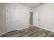 This bedroom features wood-style flooring and a large closet for ample storage space at 269 St Georges Cir, Eagle Lake, FL 33839