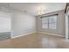 Empty dining area offering neutral paint, tile flooring and natural light from a large window at 269 St Georges Cir, Eagle Lake, FL 33839