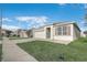 Single-Gathering home featuring a two-car garage, neutral color palette, and manicured front lawn at 269 St Georges Cir, Eagle Lake, FL 33839