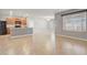 Bright open-concept kitchen with an island featuring a stainless steel sink and tile flooring throughout at 269 St Georges Cir, Eagle Lake, FL 33839