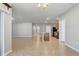 Open floor plan with tile flooring, leading to a kitchen with an island, stainless steel appliances, and ample counter space at 269 St Georges Cir, Eagle Lake, FL 33839