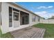A screened-in back porch with a wooden deck, providing access to the back yard at 269 St Georges Cir, Eagle Lake, FL 33839