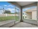 A screened-in back porch that has views of the back yard and the fence at 269 St Georges Cir, Eagle Lake, FL 33839
