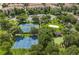 Aerial view featuring basketball court, tennis courts, and beach volleyball at 2785 Almaton Loop # 204, Kissimmee, FL 34747