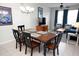 Cozy dining room features a wooden table with seating for six, a modern chandelier, and a neutral color scheme at 2785 Almaton Loop # 204, Kissimmee, FL 34747