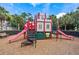 Community playground with a castle structure, slides, and climbing features at 2785 Almaton Loop # 204, Kissimmee, FL 34747