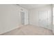 Bright bedroom with neutral carpet, closet, and a window that lets in natural light at 280 Caryota Ct, New Smyrna Beach, FL 32168