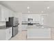 Bright kitchen featuring granite countertops, stainless steel appliances, and ample cabinet space at 280 Caryota Ct, New Smyrna Beach, FL 32168