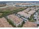A picturesque aerial shot shows the condos nearby highway, commercial buildings, and green space at 3000 Laurel Park Ln # 202, Kissimmee, FL 34741