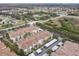 A beautiful aerial view highlights the location near shopping and major roadways of the condo community and surrounding area at 3000 Laurel Park Ln # 202, Kissimmee, FL 34741