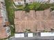 Aerial view of a condo community showcasing tiled roofs and well-maintained landscaping at 3000 Laurel Park Ln # 202, Kissimmee, FL 34741