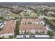 A high angle view shows the condo community's proximity to neighborhood, roads, and highways at 3000 Laurel Park Ln # 202, Kissimmee, FL 34741