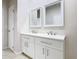 Bathroom featuring a double sink vanity with white cabinets and a glass enclosed shower at 3000 Laurel Park Ln # 202, Kissimmee, FL 34741