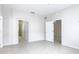 Bedroom featuring an open doorway to the bathroom and another doorway to a bedroom with a ceiling fan at 3000 Laurel Park Ln # 202, Kissimmee, FL 34741