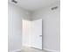 Empty room featuring tile floors, neutral paint, and a doorway at 3000 Laurel Park Ln # 202, Kissimmee, FL 34741