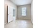 Bedroom featuring tile floors and a window at 3000 Laurel Park Ln # 202, Kissimmee, FL 34741