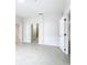 Sunlit bedroom featuring tile floors and access to an ensuite bathroom; open and airy with natural light at 3000 Laurel Park Ln # 202, Kissimmee, FL 34741