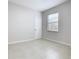 Neutral bedroom showcases ample natural light, tile flooring, and a clean, inviting space at 3000 Laurel Park Ln # 202, Kissimmee, FL 34741