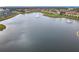 Scenic aerial shot showcasing a community lake with fountains surrounded by lush landscaping and residential buildings at 3000 Laurel Park Ln # 202, Kissimmee, FL 34741