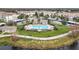 Community pool nestled among landscaped grounds, featuring ample lounge seating and a shaded pavilion for relaxation at 3000 Laurel Park Ln # 202, Kissimmee, FL 34741