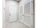 Bright entryway with tile flooring, showcasing a clean and inviting entrance with closet space for storage at 3000 Laurel Park Ln # 202, Kissimmee, FL 34741